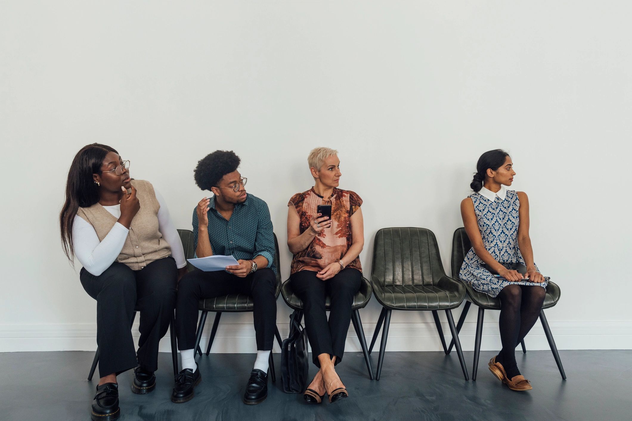 Candidates preparing for a business meeting