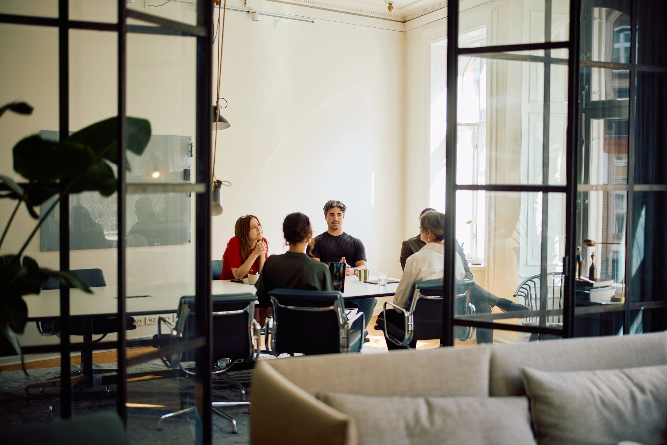 Business professionals collaborating in a modern meeting space